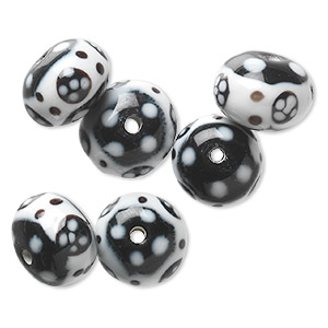 Bead, lampworked glass, opaque white and black, 15x11mm-17x12mm rondelle with flower and dot design. Sold per pkg of 6.