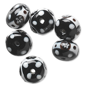 Bead, lampworked glass, opaque white and black, 17x12mm rondelle with flower and dot design. Sold per pkg of 6.