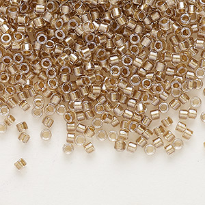 Seed bead, Delica&reg;, glass, translucent beige-lined luster crystal clear, (DB0907), #11 round. Sold per 7.5-gram pkg.