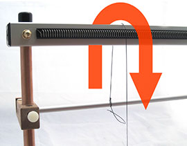 Pull Warp Thread Up Behind Loom and Down Through One Dent