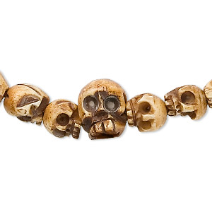Bead, bone (dyed), antiqued, hand-carved skull, Mohs hardness 2-1/2. Sold per 42-inch strand, approximately 108 beads.