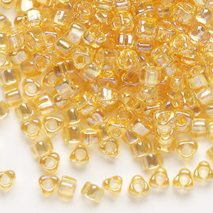 Seed bead, Miyuki, glass, transparent iris amber yellow, (TR1152), #5 triangle. Sold per 25-gram pkg.