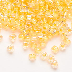 Seed bead, Miyuki, glass, transparent clear color-lined yellow, (TR1121), #5 triangle. Sold per 250-gram pkg.