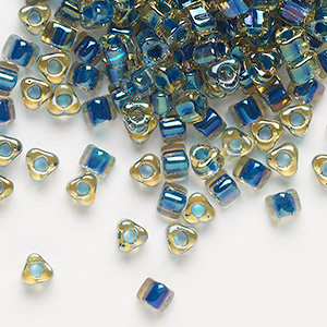 Seed bead, Miyuki, glass, transparent amber yellow color-lined dark blue, (TR1826), #5 triangle. Sold per 25-gram pkg.