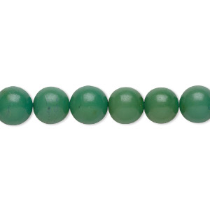Bead, nut (dyed), green, 7-9mm hand-cut round. Sold per 15-1/2&quot; to 16&quot; strand.
