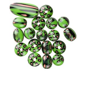 Focal and bead, acrylic, green / black / orange, assorted size and shape with dots and lines design, 2-3.5mm hole. Sold per 19-piece set.