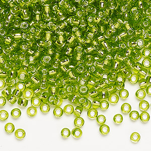 Seed bead, Dyna-Mites&#153;, glass, silver-lined translucent light green, #8 round. Sold per 40-gram pkg.