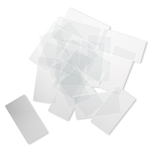 Design element, glass, clear, 2x1-inch flat rectangle with grounded edges. Sold per pkg of 20.