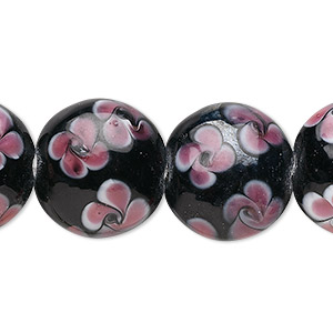Bead, glass, opaque black and pink, 19x10mm puffed flat round with flowers design. Sold per 15-1/2&quot; to 16&quot; strand.