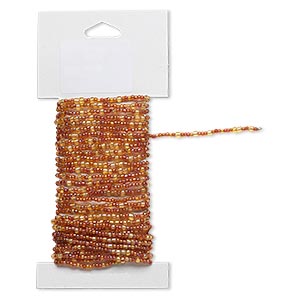 Beaded wire, glass and brass, transparent rainbow gold and orange, #9 and #6 round seed beads. Sold per 15-foot card with hanging tab.