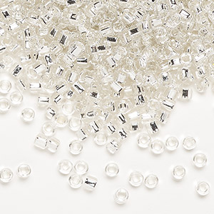 Seed bead, Dyna-Mites&#153;, glass, silver-lined translucent clear, #8 round with square hole. Sold per 1/2 kilogram pkg.