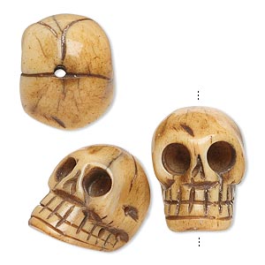 Bead, bone (dyed), antiqued, 20x14mm hand-carved skull, Mohs hardness 2-1/2. Sold per pkg of 3.