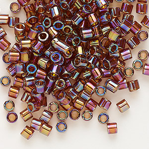 Seed bead, Delica&reg;, glass, translucent rainbow topaz, (DBL0170), #8 round. Sold per 50-gram pkg.