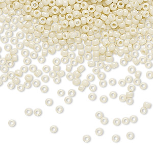 Seed bead, TOHO BEADS&reg;, glass, opaque light beige, (TR-11-51), #11 round. Sold per 7.5-gram pkg.