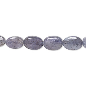 Bead, tanzanite (heated), 5x4mm-10x7mm graduated hand-cut puffed oval, C grade, Mohs hardness 6 to 7. Sold per 15&quot; to 16&quot; strand.