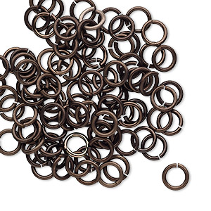 Jump ring, anodized tempered aluminum, brown, 6mm round, 4.2mm inside diameter, 18 gauge. Sold per pkg of 100.