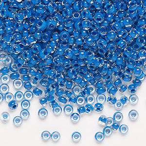 Seed bead, Preciosa Ornela Czech glass, transparent terra intensive blue-lined clear, #8 rocaille. Sold per 50-gram pkg.