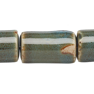 Bead, porcelain, honey and dark aqua, 26x15mm-27x16mm round tube. Sold per 8-inch strand.