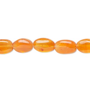 Bead, carnelian (dyed / heated), light to medium, 9x7mm-12x8mm hand-cut puffed oval, C grade, Mohs hardness 6-1/2 to 7. Sold per 13-inch strand.