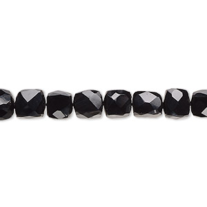 Bead, black onyx (dyed), 5mm-7x6mm hand-cut faceted cube with 0.4-1.4mm hole, B grade, Mohs hardness 6-1/2 to 7. Sold per 10-inch strand, approximately 40 beads.