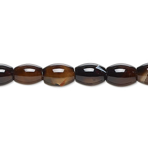 Bead, black agate (dyed), 8x6mm-9x7mm oval, C grade, Mohs hardness 6-1/2 to 7. Sold per 15-inch strand.